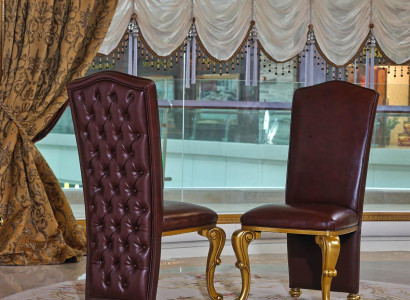 A luxurious set of 8 designer chairs in an aubergine color in Chesterfield style
